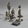 Seven Tin and Pewter Peg Lamps