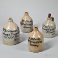 Four Stoneware Advertising Jugs