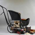 Partial Mahjong Set and a Victorian Blackpainted Wicker Baby Carriage