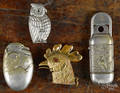 Four figural match vesta safes