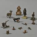 Twelve Miniature European Bronze Figures and an Enameled Miniature Clock