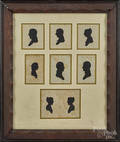 Set of seven hollowcut silhouettes of a family