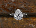 14K white gold engagement ring with a pear cut diamond