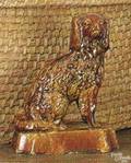 Rockingham type figure of a spaniel 19th c