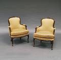 Pair of French Provincialstyle Carved Fruitwood Bergeres