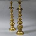 Near Pair of Brass Altar Sticks and Four Cast Brass Mythical Beasts