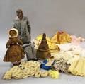 Three AfricanAmerican Dolls and Miscellaneous Doll Clothing