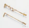 Two 14kt Gold Ridingtheme Brooches