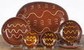 Six pieces of slip decorated Breininger redware