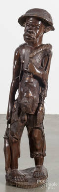 African carved figure of a fishmonger