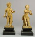 Pair of Continental Carved Ivory Figures of Cherubs