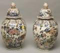 Pair of Continental Tinglazed Earthenware Japonesque Covered Vases