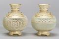 Two Similar Royal Worcester Porcelain Reticulated Vases