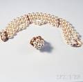 14kt Gold Triplestrand Pearl Bracelet and a 14kt Gold Gemset and Pearl Ring 