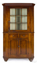 Western Pennsylvania tiger maple twopart corner cupboard early 19th c