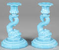 Pair of turquoise glass dolphin base candlesticks