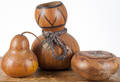Three carved and decorated Hawaiian gourds