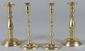 Two pairs of brass candlesticks