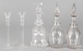 Three colorless glass decanters