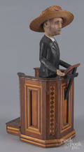 Carved and painted figure of a preacher