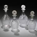 Four Blown Threemold Colorless Glass Decanters with Stoppers