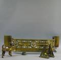 Brass Fender a Pair of Brass Bookends and a Cast Iron Dog Doorstop