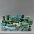 Approximately Twentyfive Glazed and Molded Art Pottery Vases Planters Thrown Items and Tableware