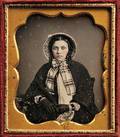 American School 19th Century Sixthplate Daguerreotype of a Young Woman Wearing a Bonnet and Gloves
