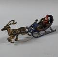 Vintage Polychromepainted Cast Iron Santa Claus and Reindeer Toy