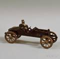 Small Blackpainted Cast Iron Toy Car with Seated Metal Driver