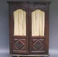 French Louis XVstyle Carved Walnut Armoire