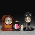 Two Poole Electric Clocks