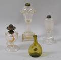 Three Pressedglass Kerosene Lamps and a Chestnut Bottle