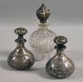 Three Sterling Silver Overlay and Silvermounted Glass Dresser Bottles