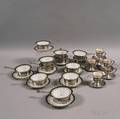 Two Sets of Sterling Silver and Porcelain Cups and Saucers