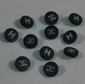 Eleven Black Chanel Buttons