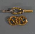 Two Gold Knot Brooches