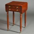 Classical Carved Mahogany and Mahogany Veneer Twodrawer Worktable