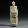 Celadon Glazed Stoneware Figure of a Monk