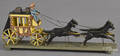 Carved and painted horse drawn stagecoach