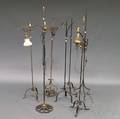 Seven Wrought Iron and Brass Floor Lamps
