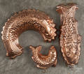 Three copper fish molds