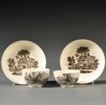 Two Staffordshire Creamcolored Earthenware Tea Bowls and Saucers