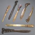 Seven Bronze Letter Openers