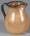 Buff clay pitcher