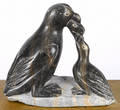 Inuit carved soapstone penguin feeding young