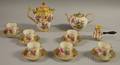 Fifteen Pieces of Gilt and Handpainted Floraldecorated Porcelain Tableware