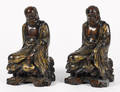 Pair of Chinese carved and gilt decorated Buddhas