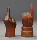 Two Small Carved Wooden Hands with Raised Fingers