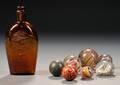 Six Assorted Glass and Pottery Marbles a Glass Paperweight and a Glass Flask